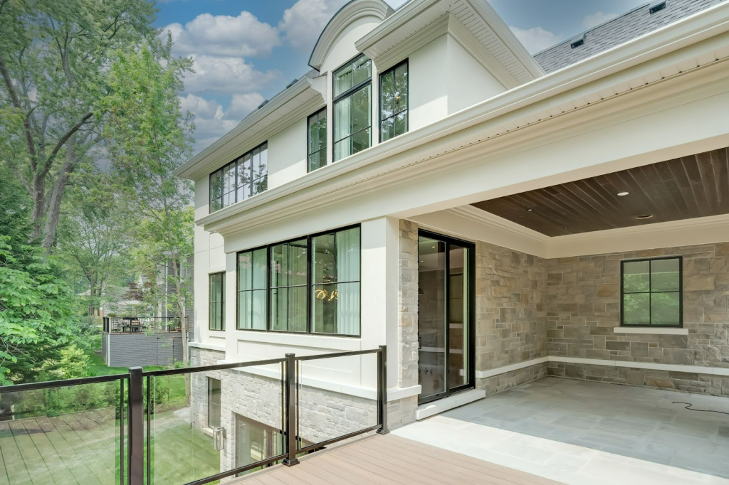 Modern home with large windows and porch| Luxury Custom Home Builder